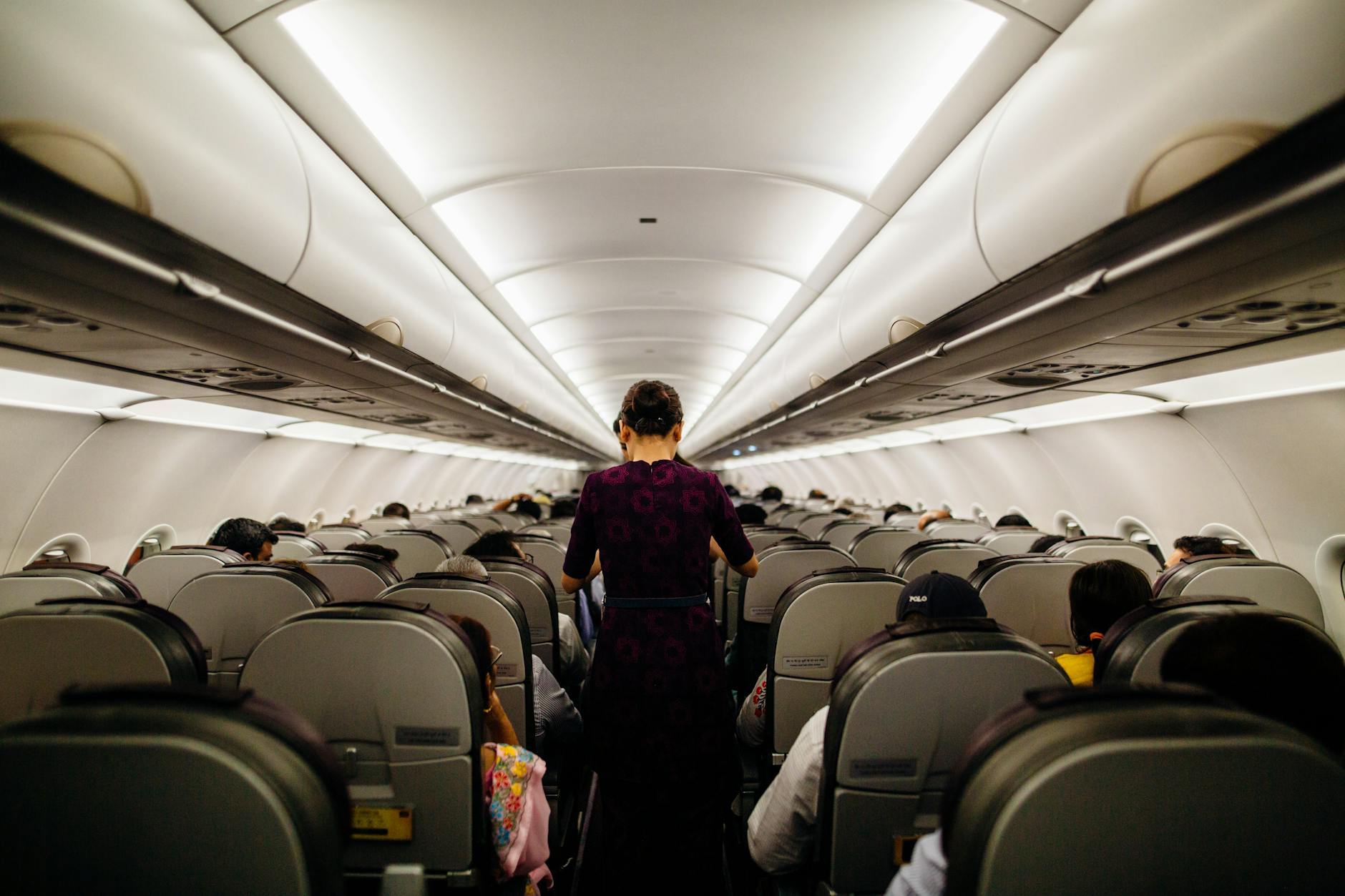 person standing inside airliner